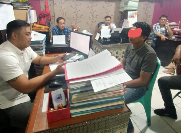 Pelaku penganiayaan saat berada di Polresta Manado